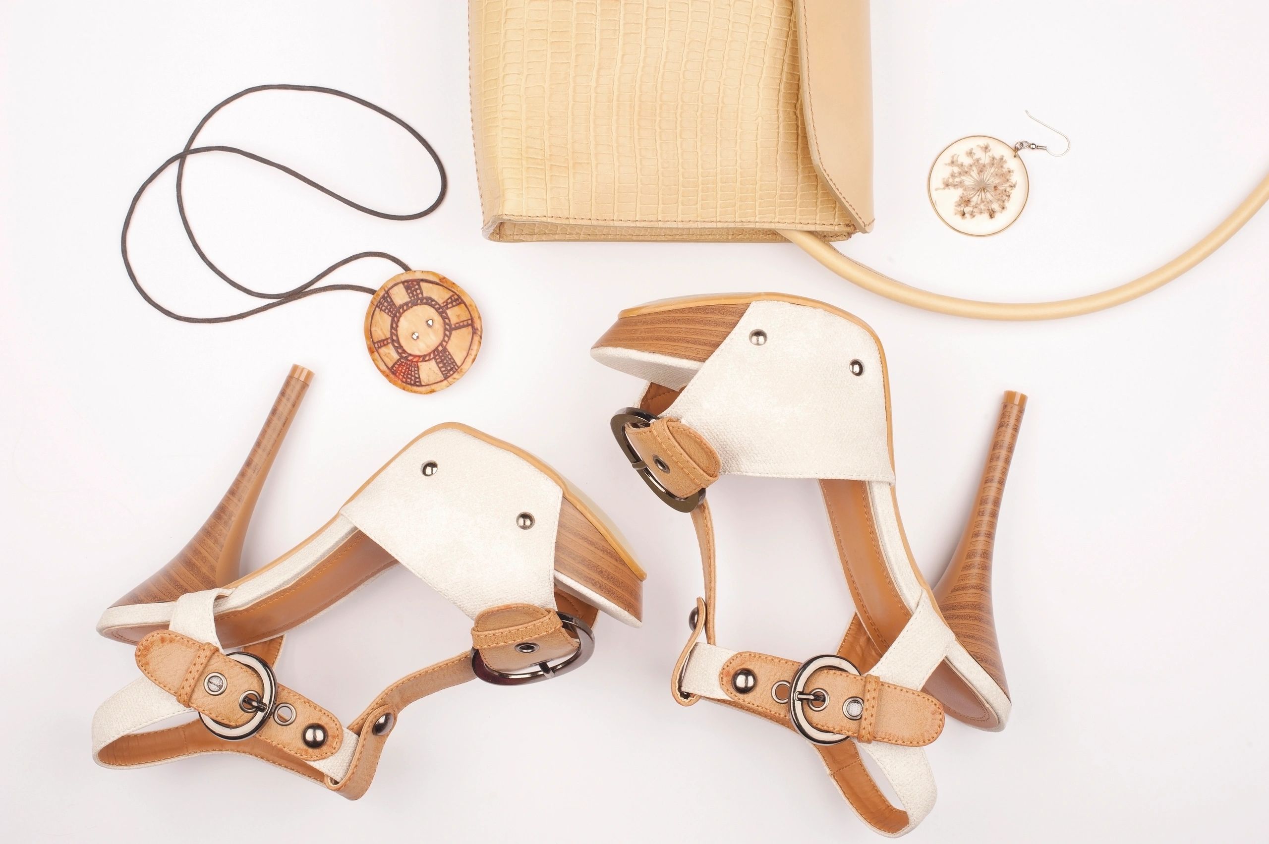 Neutral-toned fashion flat lay with accessories