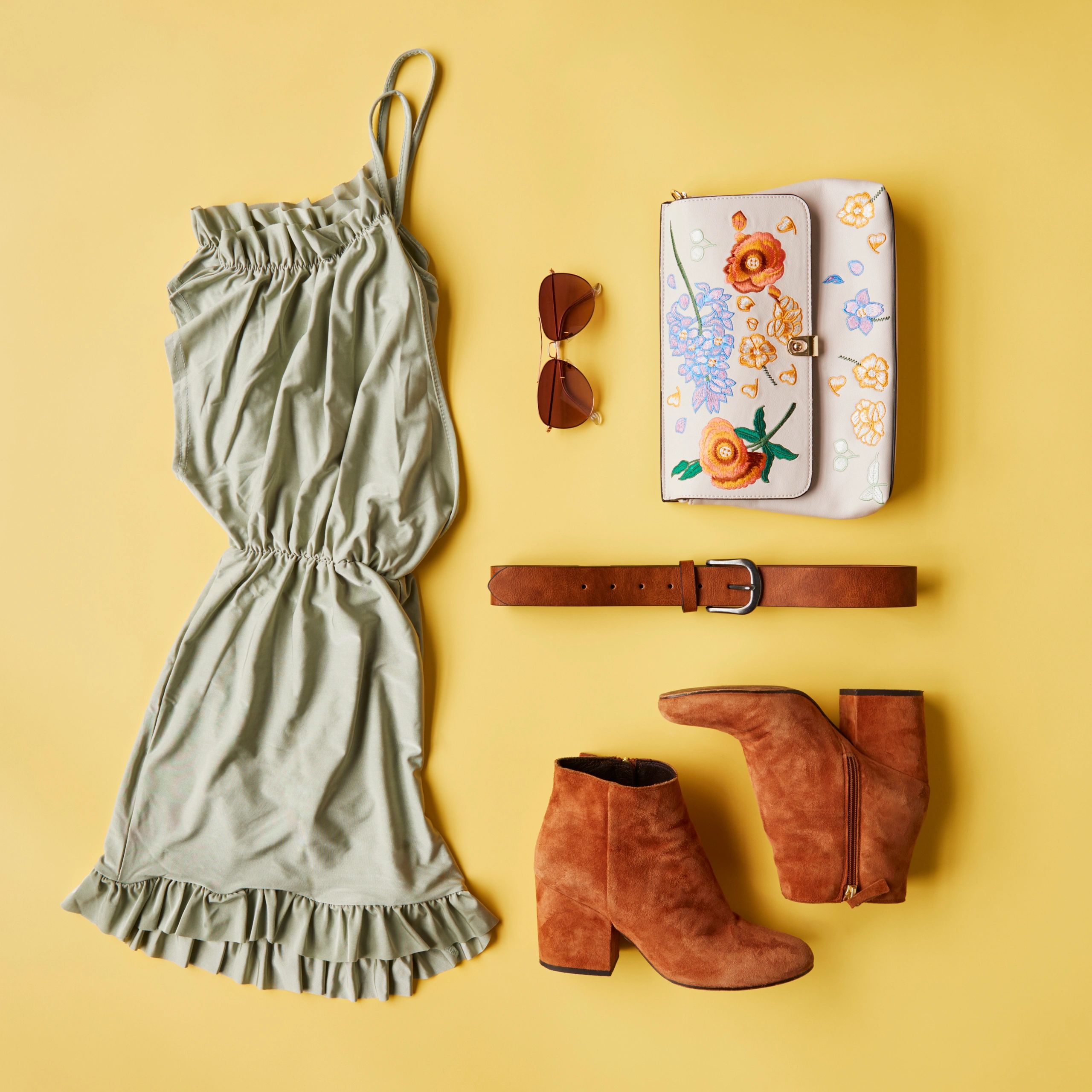 Neutral-toned clothing and accessories flat lay